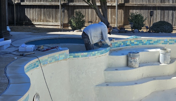 photo of glass tile replacement in swimming pool renovation